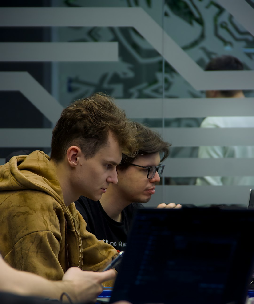 services-02 two-young-men-focused-on-computer-screens-nzgj8hme6v0